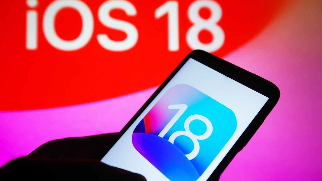 UKRAINE - 2023/09/22: In this photo illustration, iOS 18 logo is seen on a smartphone and on a pc screen in the background. (Photo Illustration by Pavlo Gonchar/SOPA Images/LightRocket via Getty Images)