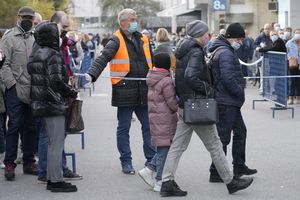 Russian citizens wait in line to get a COVID-19 vaccination in Zagreb, Croatia, Tuesday, Nov. 9, 2021. Despite soaring infections, Croatia has become a new favorite spot for Russian citizens seeking vaccination with Western jabs that are needed for travel around Europe and the U.S. (AP Photo/Darko Bandic)