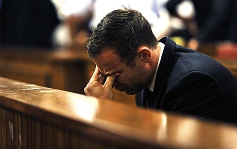 FILE PHOTO: Olympic and Paralympic track star Oscar Pistorius reacts as Judge Thokozile Masipa (unseen) delivers her verdict at the North Gauteng High Court in Pretoria September 12, 2014. REUTERS/Alon Skuy/Pool/File Photo