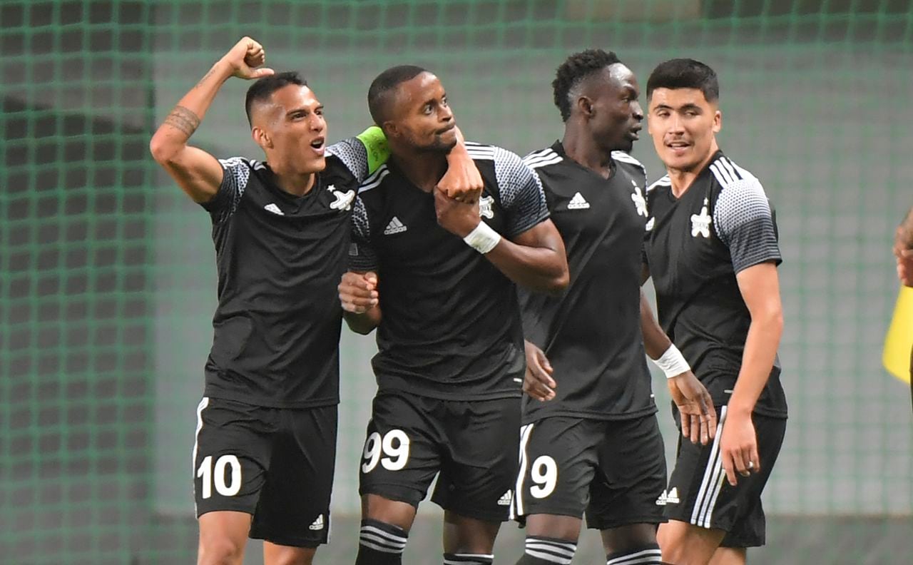 Sheriff's Momo Yansane, second right, celebrates after scoring his side's second goal during the Champions League Group D soccer match between FC Sheriff Tiraspol and Shakhtar Donetsk in Tiraspol, Moldova, Wednesday, Sept. 15, 2021. (AP Photo/str)