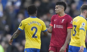 Liverpool's Luis Diaz, right, cheers with Brighton's Tariq Lamptey at the end of the English Premier League soccer match between Brighton and Hove Albion and Liverpool at the Amex stadium in Brighton, England, Saturday, March 12, 2022. Liverpool won 2-0. (AP Photo/Kirsty Wigglesworth)