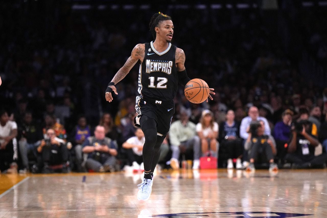 Apr 22, 2023; Los Angeles, California, USA; Memphis Grizzlies guard Ja Morant (12) dribbles the ball against the Los Angeles Lakersin the fourth quarter during game three of the 2023 NBA playoffs at Crypto.com Arena. Mandatory Credit: Kirby Lee-USA TODAY Sports
