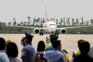 In this photo taken on September 16, 2020, a Boeing 737-800 operated by South Korean carrier T'way taxis after landing at Wuhan's Tianhe International Airport in China's central Hubei province. - China's Wuhan, ground zero for the coronavirus outbreak which has since swept the globe, has reopened its airport for international passenger flights, ending an eight-month moratorium since the deadly pathogen first emerged. (Photo by STR / AFP) / China OUT