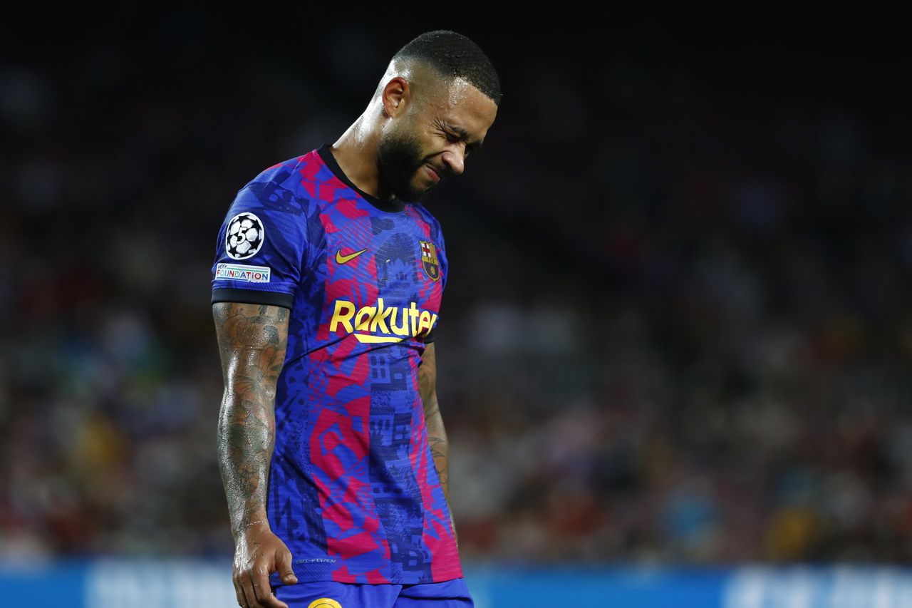 Barcelona's Memphis Depay reacts at the end of a Champions League group E soccer match between F.C. Barcelona and Bayern at Camp Nou stadium in Barcelona, Spain, Tuesday, Sept. 14, 2021. (AP Photo/Joan Monfort)