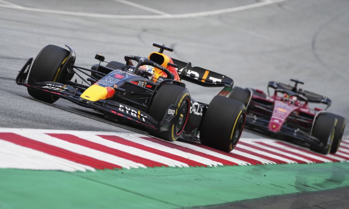 Red Bull driver Max Verstappen, left, of the Netherlands, steers his car followed by Ferrari driver Charles Leclerc, of Monaco, during the Austrian F1 Grand Prix at the Red Bull Ring racetrack in Spielberg, Austria, Sunday, July 10, 2022. (AP/Matthias Schrader)