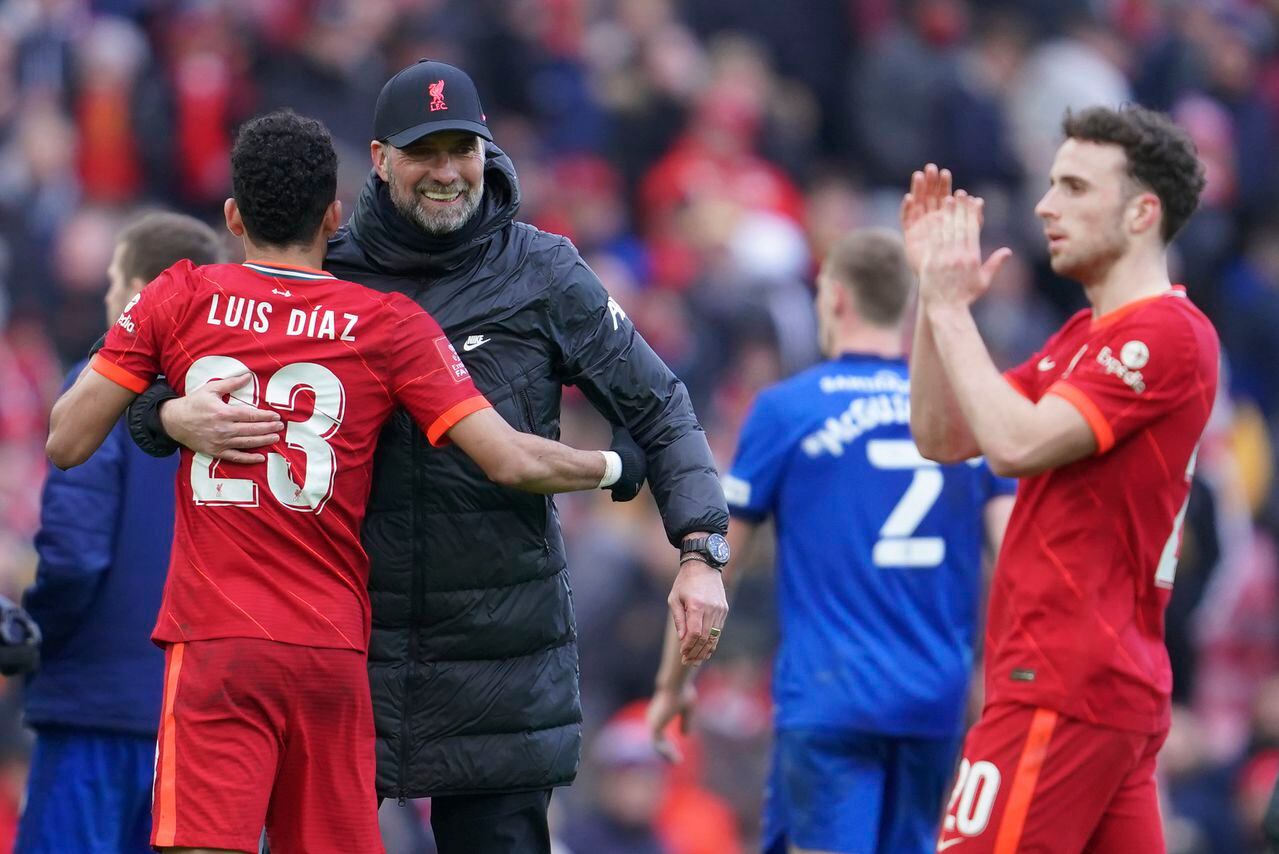 Liverpool's manager Jurgen Klopp embraces Liverpool's Luis Diaz after the FA Cup fourth round soccer match between Liverpool and Cardiff City at Anfield stadium in Liverpool, England, Sunday, Feb. 6, 2022. (AP Photo/Jon Super)