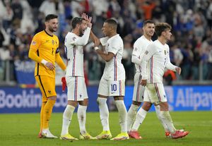 France's Theo Hernandez, second left, and France's Kylian Mbappe celebrate at the end of the UEFA Nations League semifinal soccer match between Belgium and France at the Juventus stadium, in Turin, Italy, Thursday, Oct. 7, 2021. France won the match 3-2. (AP Photo/Luca Bruno)