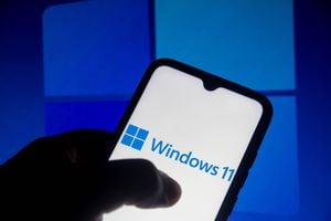 In this photo illustration the Windows 11 logo seen displayed on a smartphone. 
It is a major version of the Windows NT operating system. (Photo Illustration by Rafael Henrique/SOPA Images/LightRocket via Getty Images)