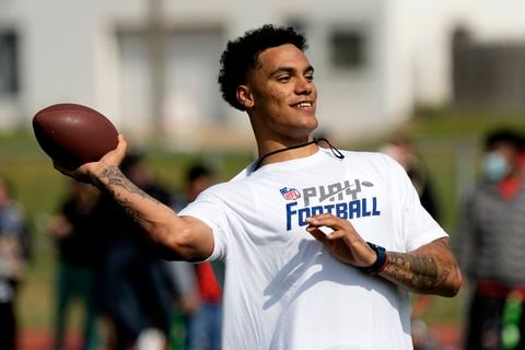 NFL draft prospect Christian Gonzalez takes part in a Play Football clinic ahead of the NFL draft Wednesday, April 26, 2023, at Center High School in Kansas City, Mo. The draft will run from April 27-29. (AP Photo/Charlie Riedel)