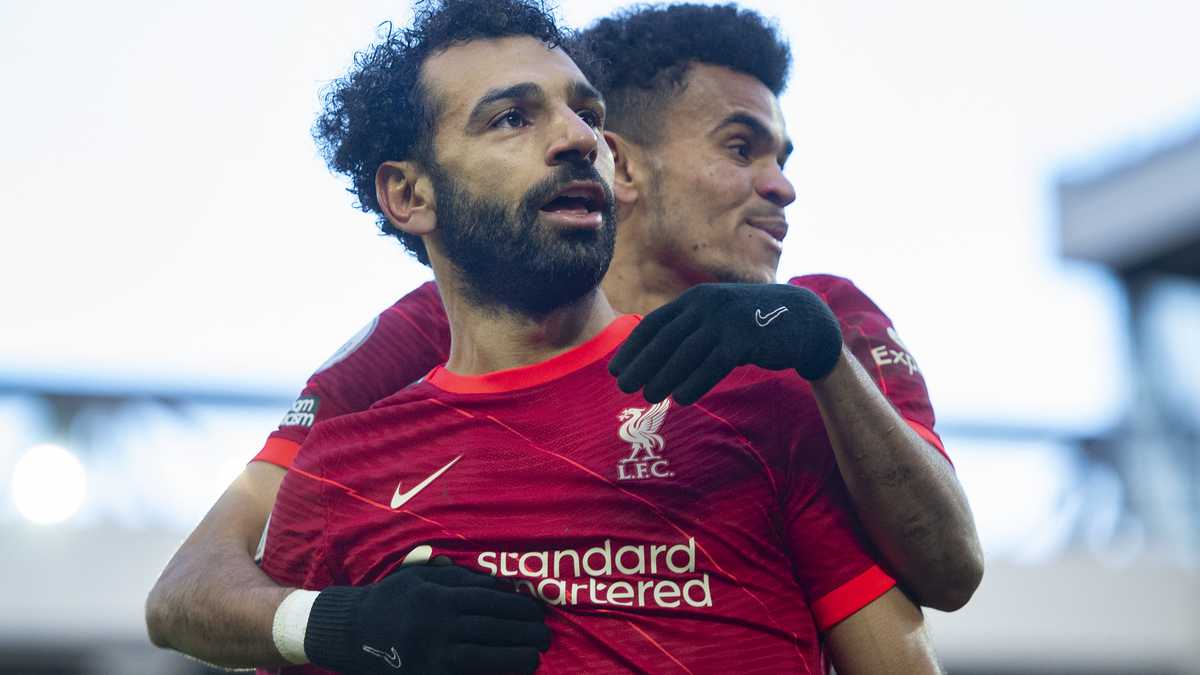 LIVERPOOL, ENGLAND - FEBRUARY 19: Mohamed Salah of Liverpool celebrates scoring his team's second goal and his one hundred and fiftieth for the club with team mate Luis Diaz  during the Premier League match between Liverpool and Norwich City at Anfield on February 19, 2022 in Liverpool, United Kingdom. (Photo by Joe Prior/Visionhaus via Getty Images)