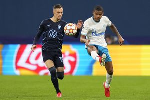 Malmo's Veljko Birmancevic, left, challenges for the ball with Zenit's Wilmar Barrios during the Champions League, group H, soccer match, between Zenit St. Petersburg and Malmo at the Gazprom Arena in St.Petersburg, Russia, Wednesday, Sept. 29, 2021. (AP Photo/Dmitry Lovetsky)
