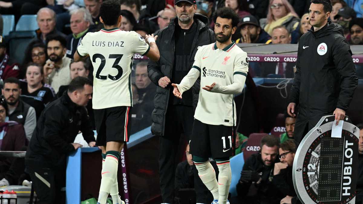 Liverpool's Colombian midfielder Luis Diaz (L) leaves the pitch after being substituted off for Liverpool's Egyptian midfielder Mohamed Salah (R) during the English Premier League football match between Aston Villa and Liverpool at Villa Park in Birmingham, central England on May 10, 2022. (Photo by Paul ELLIS / AFP) / RESTRICTED TO EDITORIAL USE. No use with unauthorized audio, video, data, fixture lists, club/league logos or 'live' services. Online in-match use limited to 120 images. An additional 40 images may be used in extra time. No video emulation. Social media in-match use limited to 120 images. An additional 40 images may be used in extra time. No use in betting publications, games or single club/league/player publications. /