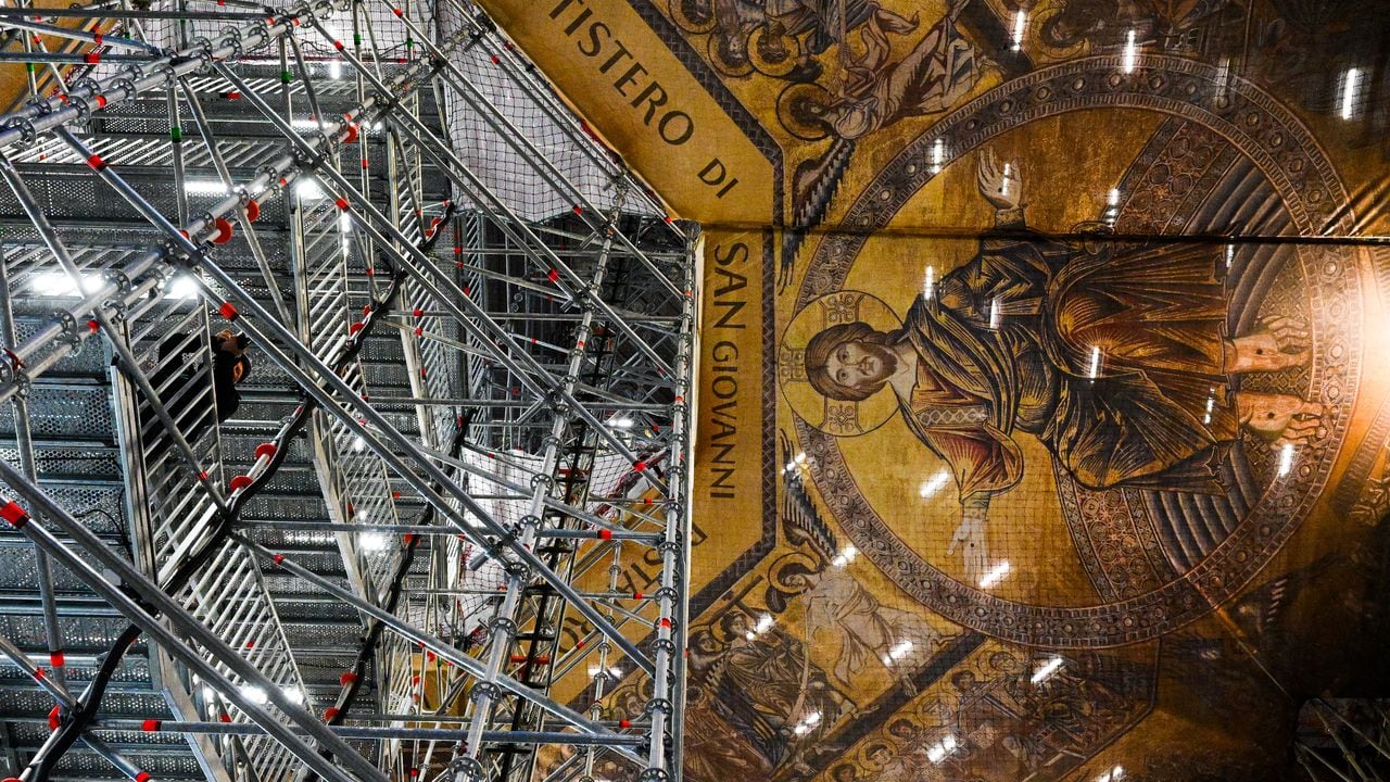 A view shows the mosaic ceiling of the Baptistery of San Giovanni, one of the most ancient churches in Florence, Tuscany, during the presentation of the start of a six-year restoration of its mosaic ceiling, on February 8, 2023. - The mosaic ceiling of the Florence Baptistery, a set of mosaics covering the internal dome and apses, is one of the most important cycles of medieval Italian mosaics, created between 1225 and around 1330 using designs by major Florentine painters. (Photo by Vincenzo PINTO / AFP)