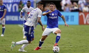 Everton FC midfielder James Rodriguez, right, makes a move to get around Millonarios FC defender Juan Pablo Vargaas, left, during the first half of a Florida Cup soccer match, Sunday, July 25, 2021, in Orlando, Fla. (AP Photo/John Raoux)