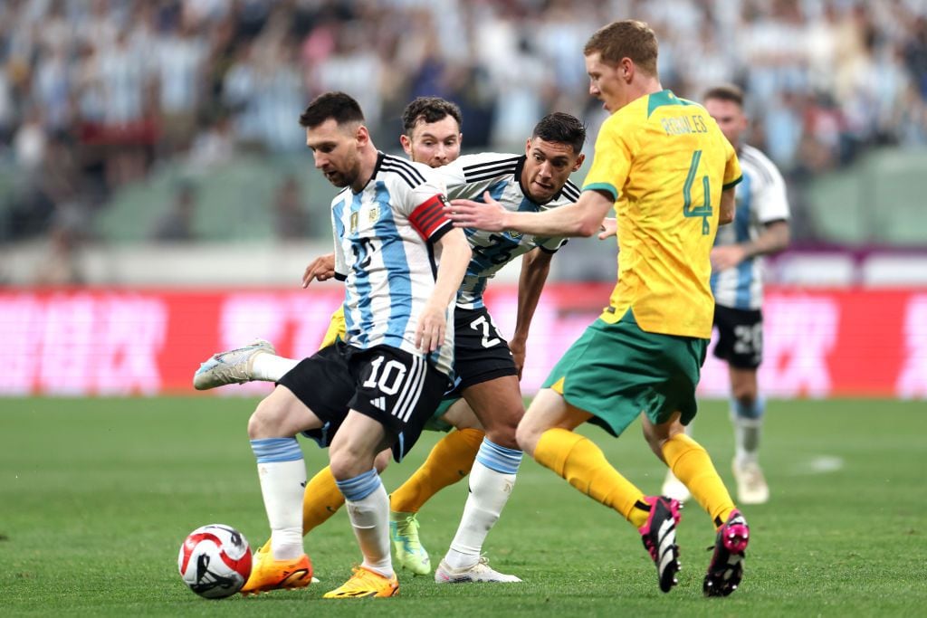 BEIJING, CHINA - JUNE 15: Lionel Messi of Argentina controls the ball against Kye Rowles of Australia during the international friendly match between Argentina and Australia at Workers Stadium on June 15, 2023 in Beijing, China. (Photo by Lintao Zhang/Getty Images)