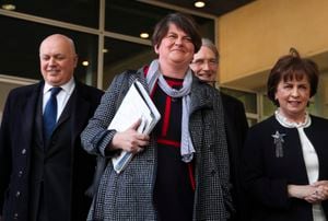 FILE - In this Thursday, April 11, 2019 file photo, Northern Ireland Democratic Unionist Party leader Arlene Foster, center, speaks to journalists after her meeting with European Union chief Brexit negotiator Michel Barnier at EU headquarters in Brussels. Foster, the leader of Northern Ireland announced her resignation on Wednesday, April 28 after party members mounted a push to oust her over her handling of the fallout from Brexit and other issues. Foster said she would step down as leader of the Democratic Unionist Party on May 28 and as First Minister of Northern Ireland at the end of June. (AP Photo/Francisco Seco, File)