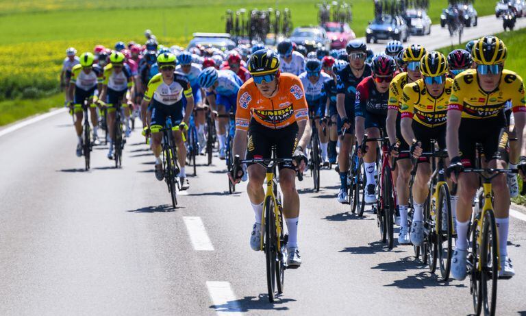 Rohan Dennis from Australia pedals with the pack during the first stage, a 178 km race between La Grande Beroche and Romont at the 75th Tour de Romandie UCI ProTour cycling race in Romont, Switzerland, Wednesday, April 27, 2022. (AP/Jean-Christophe Bott/Keystone)