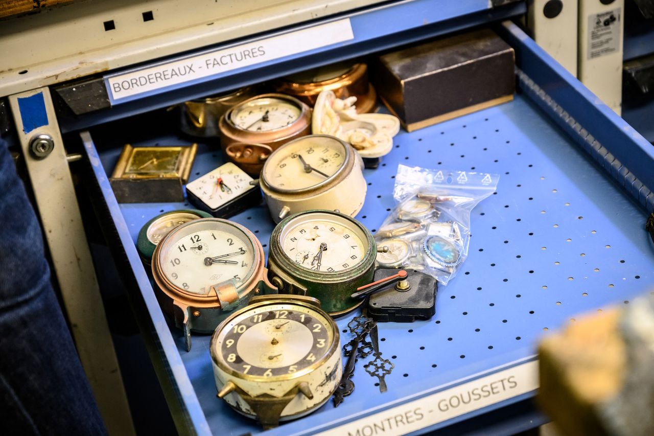 A photograph taken on January 6, 2022 shows a drawer of alarm clocks in the Christophe Demoulin's workshop, head of the props of the Comedie-Francaise in Paris. (Photo by BERTRAND GUAY / AFP)