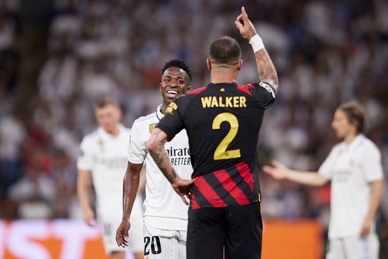 MADRID, SPAIN - 2023/05/09: Vinicius Jr. of Real Madrid reacts with Kyle Walker of Manchester City FC during the UEFA Champions League semifinal first leg football match between Real Madrid CF and Manchester City at the Santiago Bernabeu Stadium in Madrid. The final score of the game is Real Madrid 1 - 1 Manchester City. (Photo by Ruben Albarran/SOPA Images/LightRocket via Getty Images)
