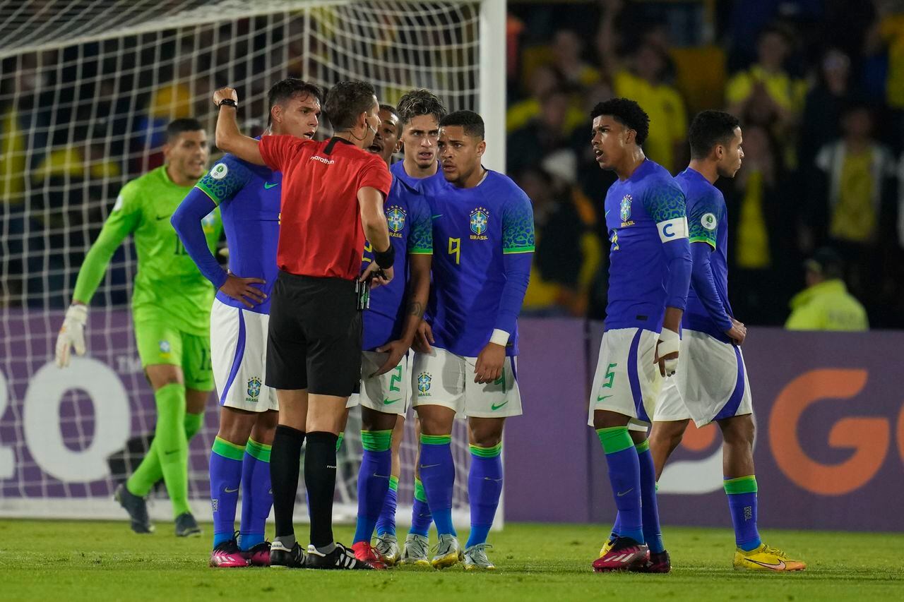 Brazil players argue to Referee Nicolas Lamolina during a South America U-20 Championship soccer match against Colombia, in Bogota, Colombia, Thursday, Feb. 9, 2023. (AP Photo/Fernando Vergara)