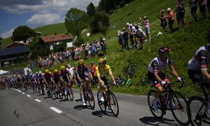 UAE Team Emirates riders, right, set the pace for their leader Slovenia's Tadej Pogacar, wearing the overall leader's yellow jersey, as they climb during the ninth stage of the Tour de France cycling race over 193 kilometers (119.9 miles) with start in Aigle, Switzerland and finish in Chatel les Portes du Soleil, France, Sunday, July 10, 2022. (AP Photo/Thibault Camus)
