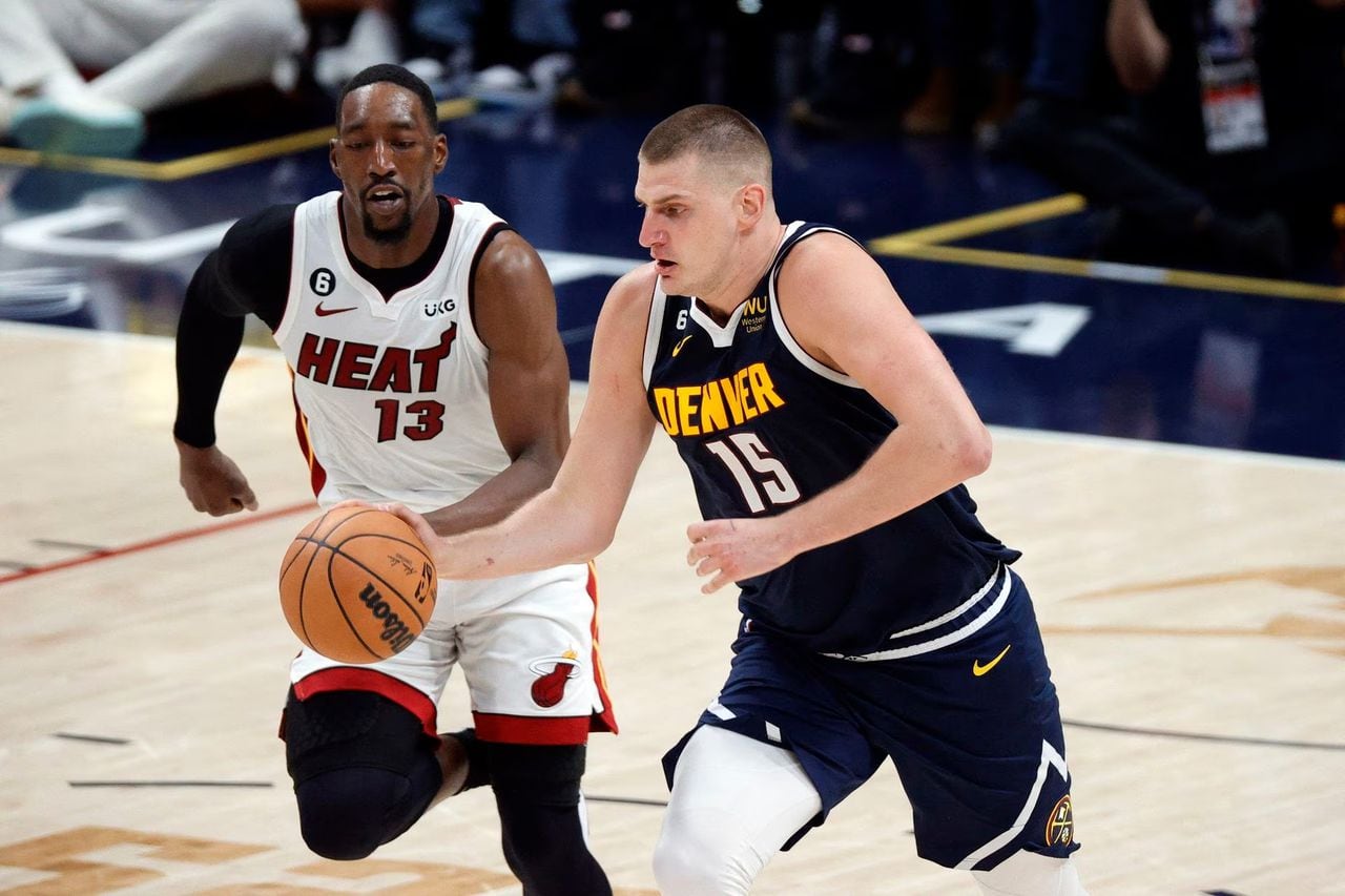 Jun 4, 2023; Denver, CO, USA; Denver Nuggets center Nikola Jokic (15) controls the ball against Miami Heat center Bam Adebayo (13) in the second quarter in game two of the 2023 NBA Finals at Ball Arena. Mandatory Credit: Isaiah J. Downing-USA TODAY Sports