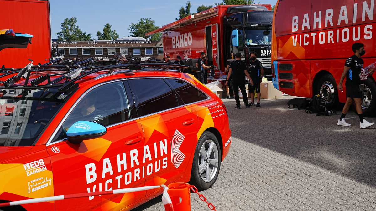 Bahrain Victorious staff outside their hotel in Glostrup, Denmark, Thursday, June 30, 2022. The Bahrain Victorious team at the Tour de France has been raided by police for the second time this week. Danish police searched the riders' hotel rooms in suburban Copenhagen on Thursday. (AP/Bo Amstrup/Ritzau Scanpix)