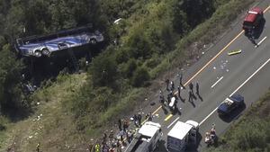Emergency responders work the scene of a fatal bus crash, in Wawayanda, N.Y., Thursday, Sept. 21, 2023. The charter bus carrying high school students to a band camp hurtled off a New York highway and down an embankment, officials said. (NBC New York via AP)