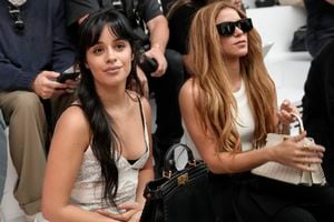 Camila Cabello, left, and Shakira attend the Fendi Haute Couture Fall/winter 2023-2024 fashion collection presented in Paris, Thursday, July 6, 2023. (AP Photo/Christophe Ena)