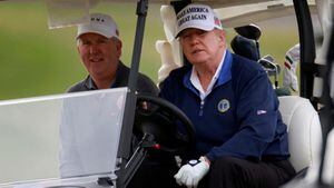 FILE PHOTO: U.S. President Donald Trump drives a golf cart at the Trump National Golf Club in Sterling, Virginia, U.S., November 22, 2020. REUTERS/Hannah McKay/File Photo