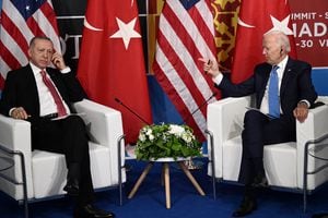 US President Joe Biden (R) gestures as Turkey's President Recep Tayyip Erdogan listens during a bilateral meeting on the sidelines of the NATO summit at the Ifema congress centre in Madrid, on June 29, 2022. (Photo by Brendan SMIALOWSKI / AFP)