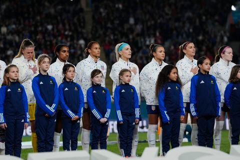 United States players stand on the field during the national anthem before the FIFA Women's World Cup Group E soccer match between Portugal and the United States at Eden Park in Auckland, New Zealand, Tuesday, Aug. 1, 2023. (AP Photo/Abbie Parr)