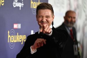 (FILES) In this file photo taken on November 17, 2021 US actor Jeremy Renner arrives for the premiere of Marvel Studios' television miniseries "Hawkeye" at the El Capitan Theatre in Los Angeles. - Movie star Jeremy Renner, known for his role as Hawkeye in several Marvel blockbusters, was in critical but stable condition following an accident while plowing snow, his representative told US media. Renner was using a truck-sized tracked snow vehicle about a quarter mile from his mountain home on January 1, 2023 when the vehicle accidentally ran over one of his legs, the TMZ tabloid news website said. (Photo by Robyn Beck / AFP)