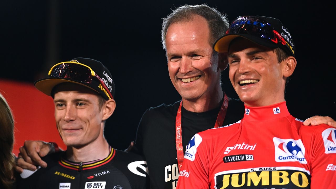 MADRID, SPAIN - SEPTEMBER 17: (L-R) Jonas Vingegaard of Denmark on second place, Team Jumbo-Visma general manager Richard Plugge of Netherlands and race winner Sepp Kuss of The United States - Red Leader Jersey pose on the podium ceremony after the 78th Tour of Spain 2023, Stage 21 a 101.5km stage from Hipódromo de la Zarzuela to Madrid. Paisaje de la Luz / #UCIWT / on September 17, 2023 in Madrid, Spain. (Photo by Tim de Waele/Getty Images)