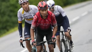 Colombia's Nairo Quintana, center, Spain's Omar Fraile, left, and Michael Woods of Canada climb Col des Saisies pass during the ninth stage of the Tour de France cycling race over 144.9 kilometers (90 miles) with start in Cluses and finish in Tignes, France, Sunday, July 4, 2021. (AP Photo/Daniel Cole)