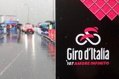 This photograph shows a Giro's placard at the start of the 16th stage of the 107th Giro d'Italia cycling race, 206km between Livigno and Santa Cristina Val Gardena on May 21, 2024. Due to bad weather condition, the route changes and the start will take place in Prati allo Stelvio. (Photo by Luca Bettini / AFP)