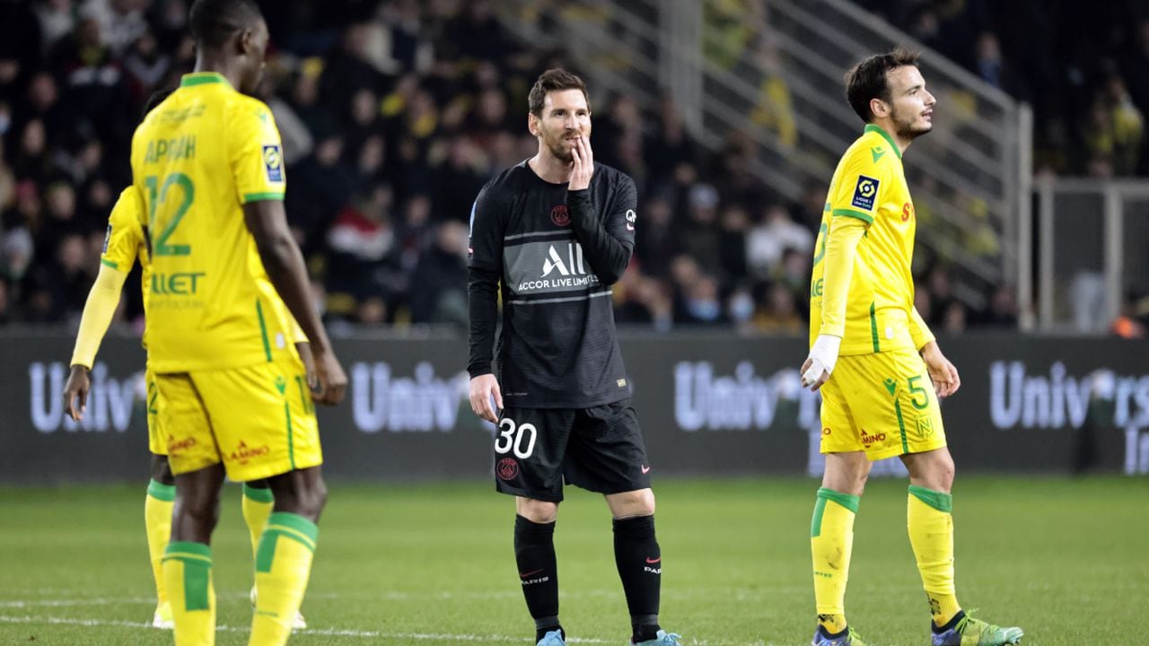 PSG's Lionel Messi, center, reacts during the French League One soccer match between Nantes and Paris Saint-Germain at the Stade de la Beaujoire in Nantes, western France, Saturday, Feb.19, 2022. (AP/Jeremias Gonzalez)