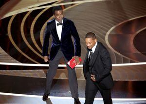 HOLLYWOOD, CA - March 27, 2022.    Chris Rock and Will Smith onstage during the show  at the 94th Academy Awards at the Dolby Theatre at Ovation Hollywood on Sunday, March 27, 2022.  (Myung Chun / Los Angeles Times via Getty Images)