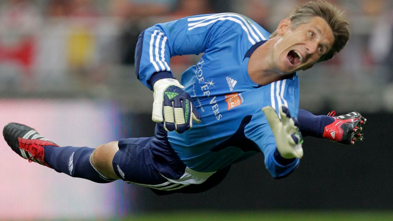 FILE - Former Manchester United goalkeeper Edwin van der Sar watches the ball as he saves on an attempt to score during his farewell tribute match at Amsterdam's ArenA stadium on Aug. 3, 2011. Former Netherlands and Manchester United goalkeeper Edwin van der Sar is in intensive care in a hospital after suffering a bleed in his brain, his former club Ajax said Friday, July 7, 2023. (AP Photo/Peter Dejong, File)