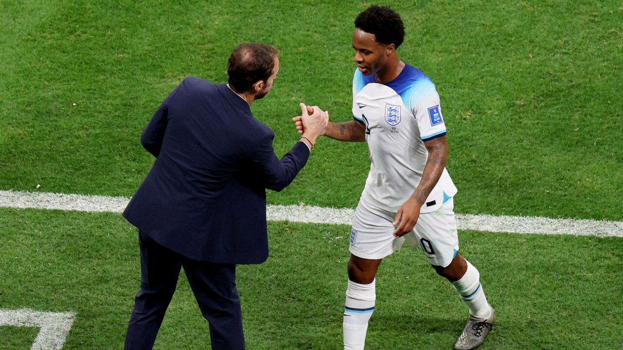 Soccer Football - FIFA World Cup Qatar 2022 - Group B - England v United States - Al Bayt Stadium, Al Khor, Qatar - November 25, 2022 England's Raheem Sterling shakes hands with manager Gareth Southgate after being substituted REUTERS/Molly Darlington