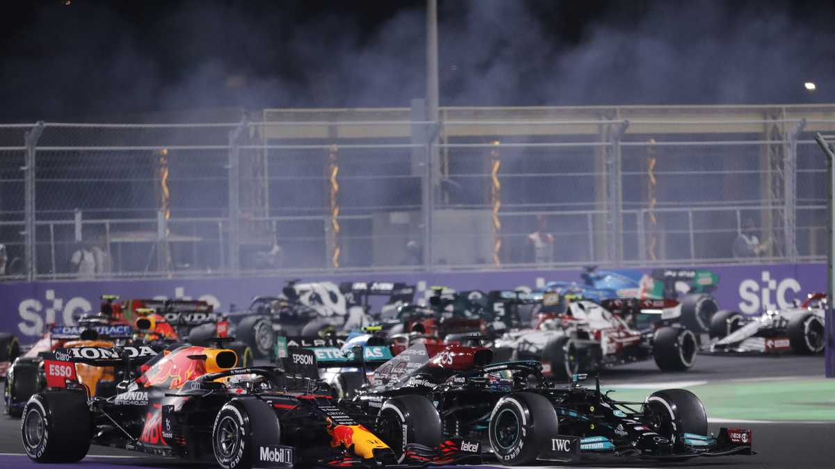 Red Bull driver Max Verstappen of the Netherlands, left, and Mercedes driver Lewis Hamilton of Britain in action during the Formula One corniche circuit, in Jiddah, Saudi Arabia, Sunday, Dec. 5, 2021. (AP Photo/Amr Nabil)
