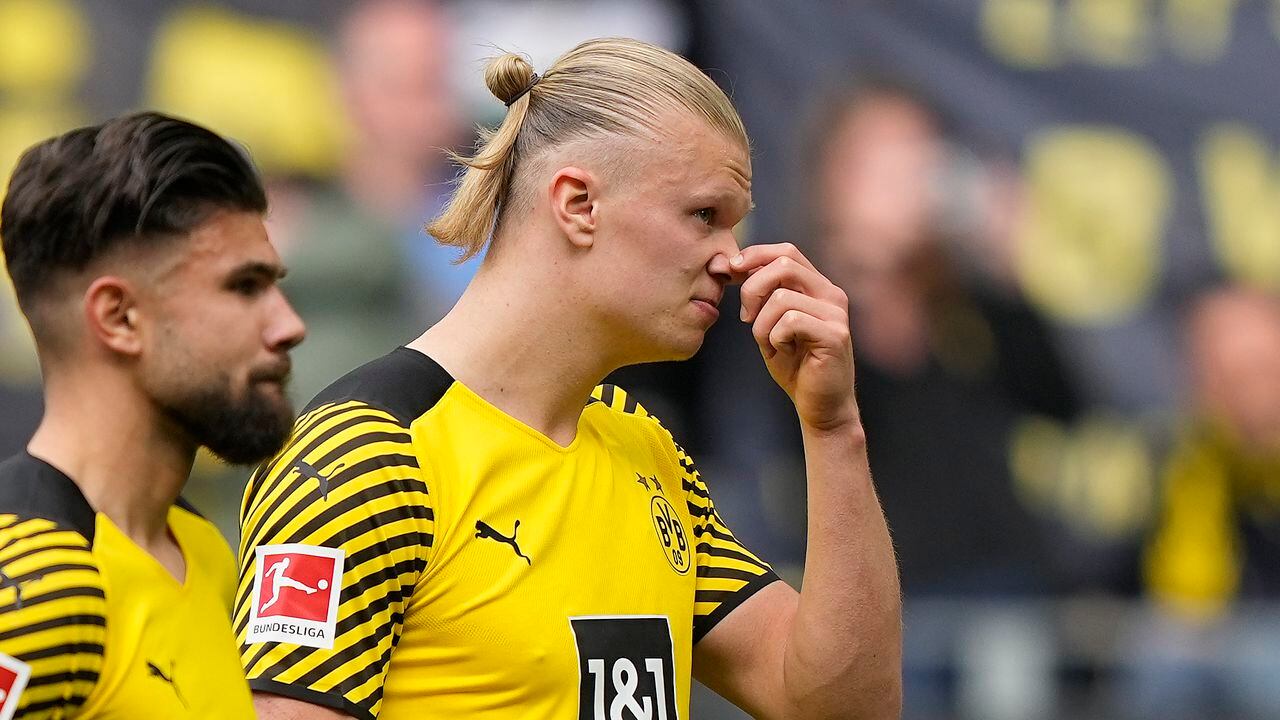 Dortmund's Erling Haaland, right, reacts disappointed in front of their supporters after losing the German Bundesliga soccer match between Borussia Dortmund and VfL Bochum in Dortmund, Germany, Saturday, April 30, 2022. (AP Photo/Martin Meissner)