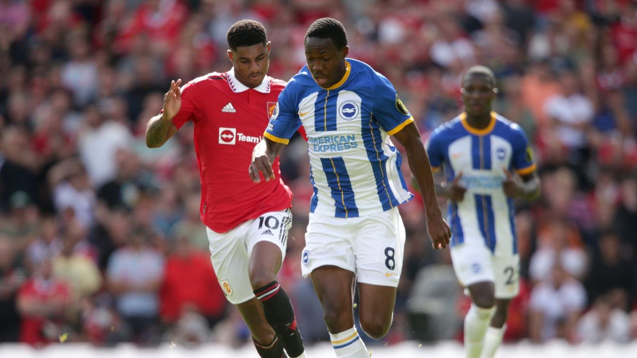 Manchester United's Marcus Rashford (left) and Brighton and Hove Albion's Enock Mwepu during the Premier League match at Old Trafford, Manchester. Picture date: Sunday August 7, 2022. (Photo by Getty Images/Ian Hodgson/PA Images)