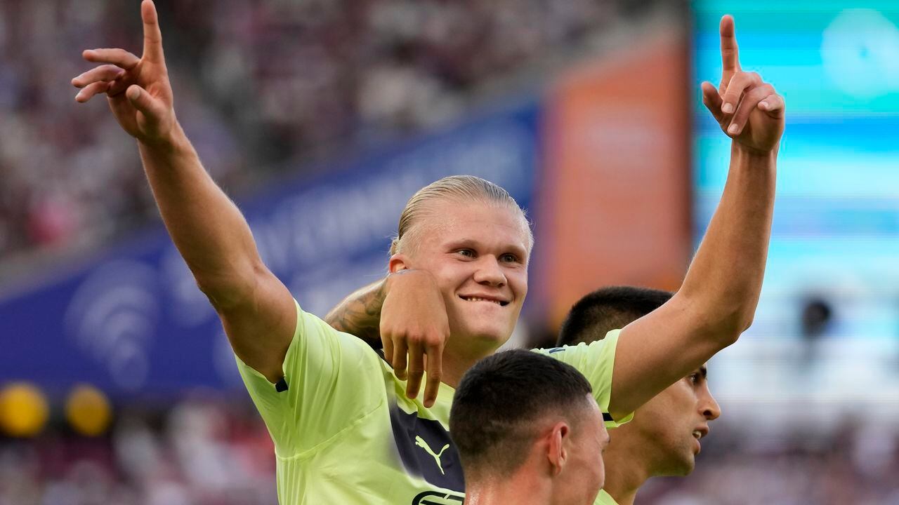 Manchester City's Erling Haaland celebrates after scoring his sides second goal during the English Premier League soccer match between West Ham United and Manchester City at the London Stadium in London, England, Sunday, Aug. 7, 2022. (AP Photo/Frank Augstein)