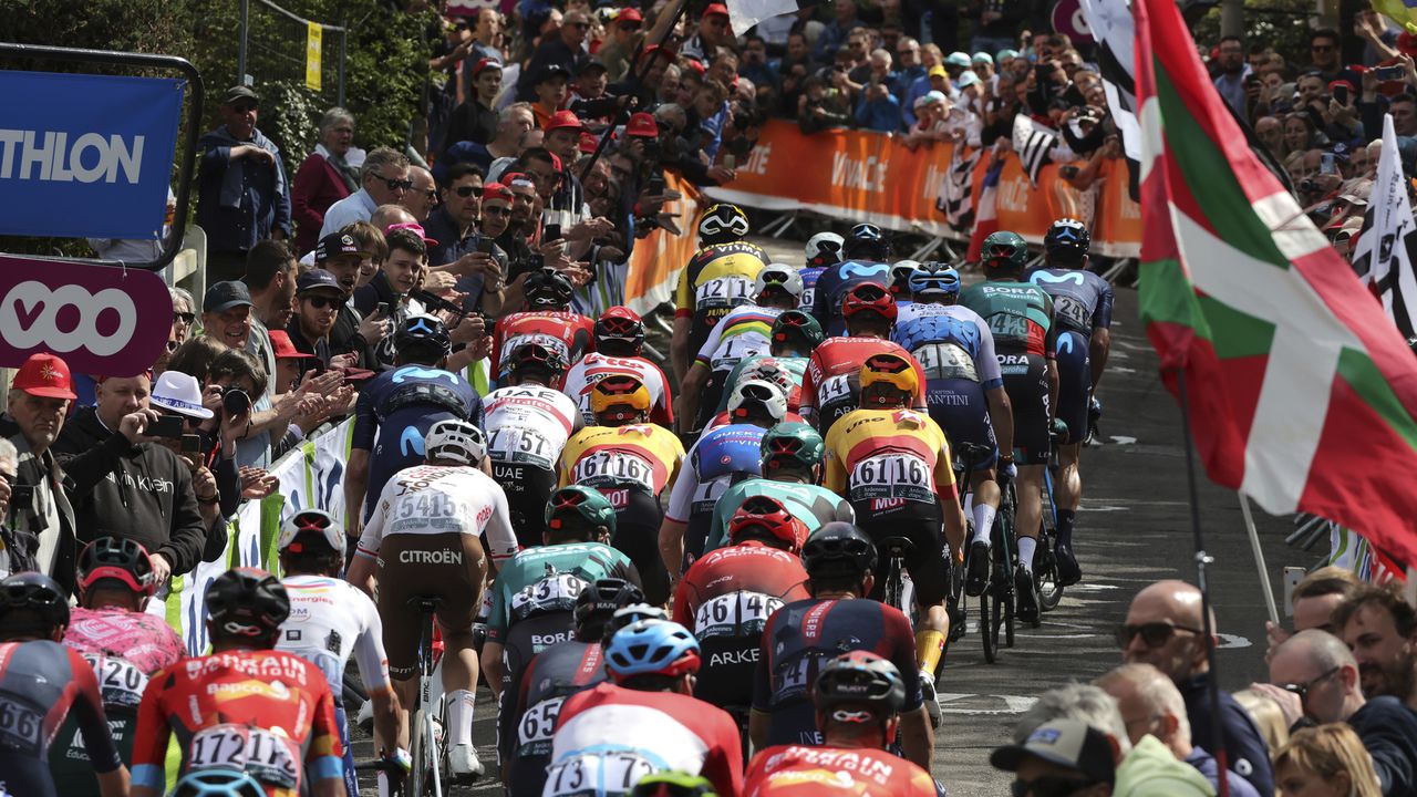 Riders climb up the Wall of Huy during the Belgian cycling classic and UCI World Tour race Fleche Wallonne (Walloon Arrow), in Huy, Belgium, Wednesday, April 20, 2022. (AP Photo/Olivier Matthys)