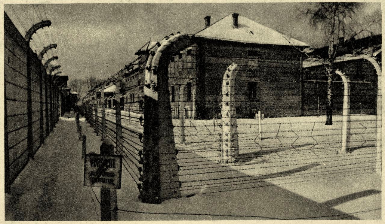 Auschwitz concentration camp -view of the 11th barrack with barbed wire. Source: Museum of O?wi?cim, Poland. - Photos taken by guard or SS. Publication date of postcard not known.  Konzentrationslager Auschwitz. Site of murdered Jews. (Photo by Culture Club/Getty Images)