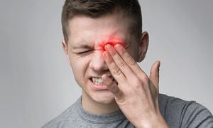 Upset man suffering from strong eye pain. Healthcare concept, panorama
