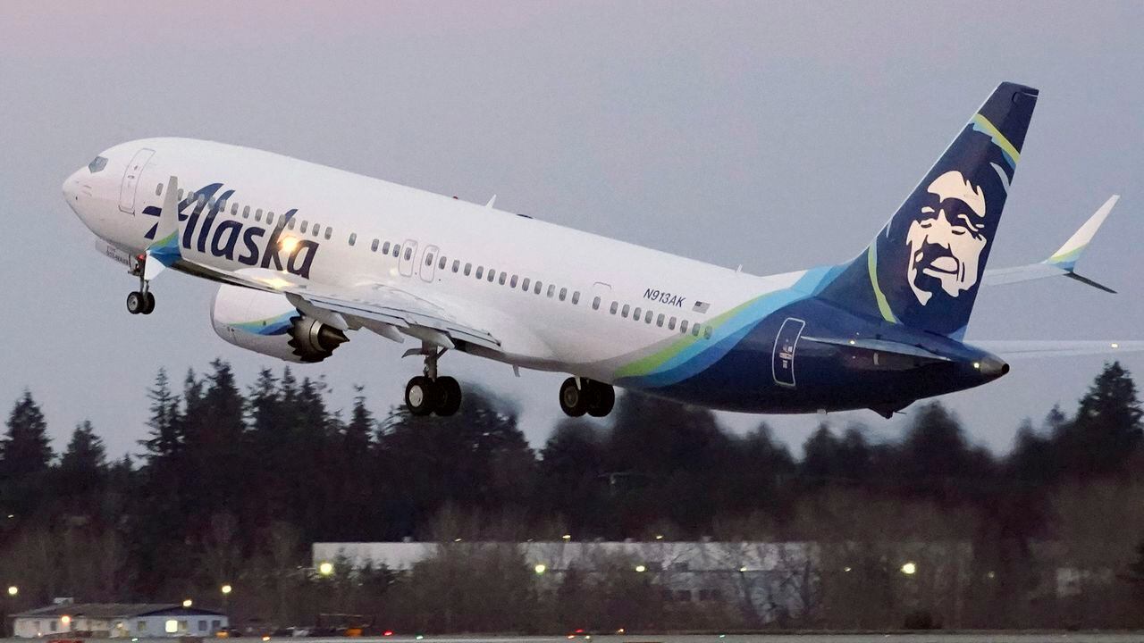 FILE - In this Monday, March 1, 2021 file photo, The first Alaska Airlines passenger flight on a Boeing 737-9 Max airplane takes off on a flight to San Diego from Seattle-Tacoma International Airport in Seattle. Many new Boeing 737 Max jetliners are still grounded by an electrical problem in a backup power-control unit. The Federal Aviation Administration said Thursday, April 22, 2021 that 106 planes worldwide are grounded, including 71 in the United States. Airlines are waiting for Boeing to come up with a plan for repairing the planes, and that plan would need FAA approval. (AP Photo/Ted S. Warren, File)