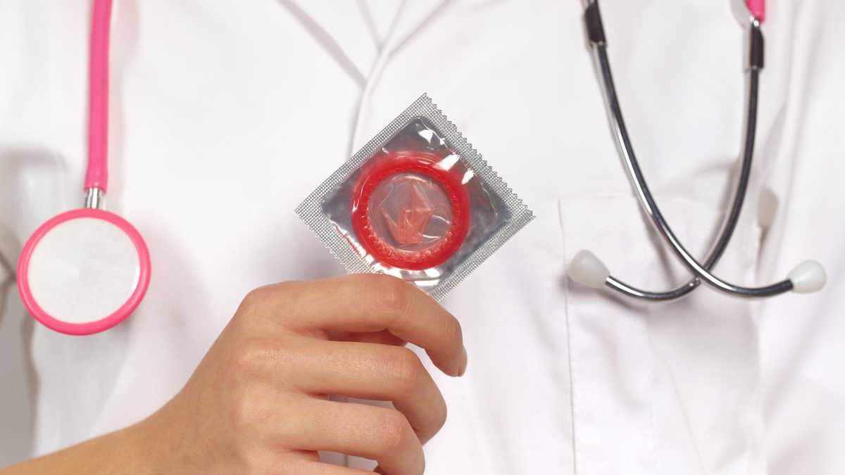 Doctor with condom