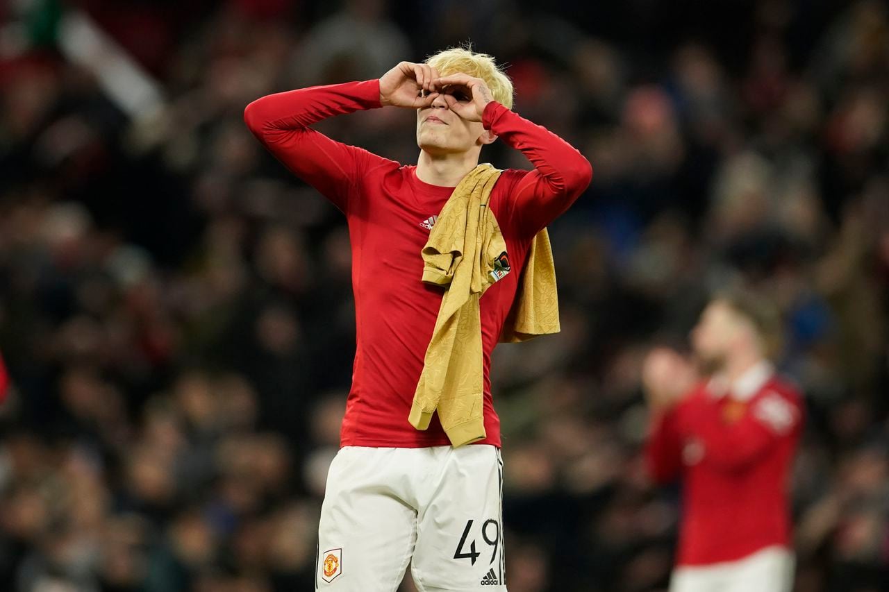 Manchester United's Alejandro Garnacho celebrates at the end of the Europa League playoff second leg soccer match between Manchester United and Barcelona at Old Trafford stadium in Manchester, England, Thursday, Feb. 23, 2023. Manchester United won 2-1. (AP Photo/Dave Thompson)